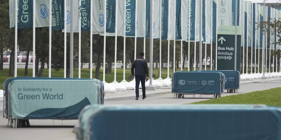 A member of security walks outside the venue for the COP29