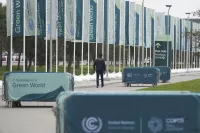 A member of security walks outside the venue for the COP29