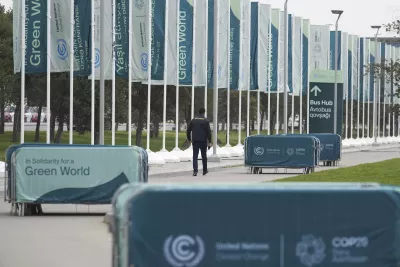 A member of security walks outside the venue for the COP29