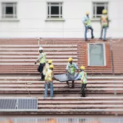 Workers installing solar panels